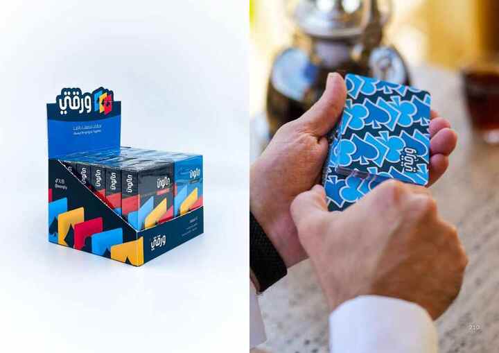 Warqtiy playing cards held in a hand